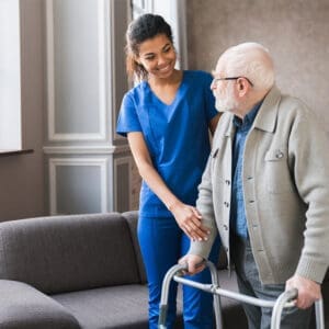 A nurse and an old man with a walker